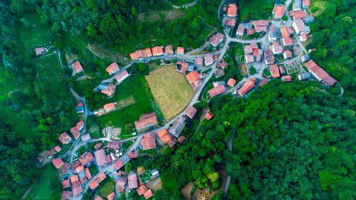 Free A picturesque aerial view of Soto de Sajambre village surrounded by lush greenery, Spain. Stock Photo
