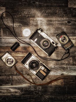 A collection of vintage cameras displayed on a rustic wooden surface, evoking nostalgia and classic photography.