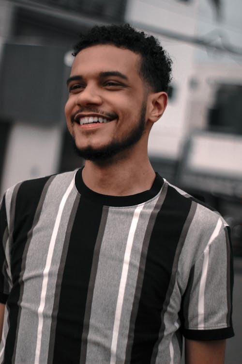 A Man Smiling while Wearing a Shirt