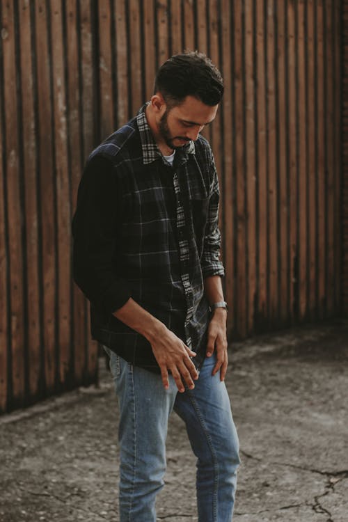 A Man Standing while Looking Down