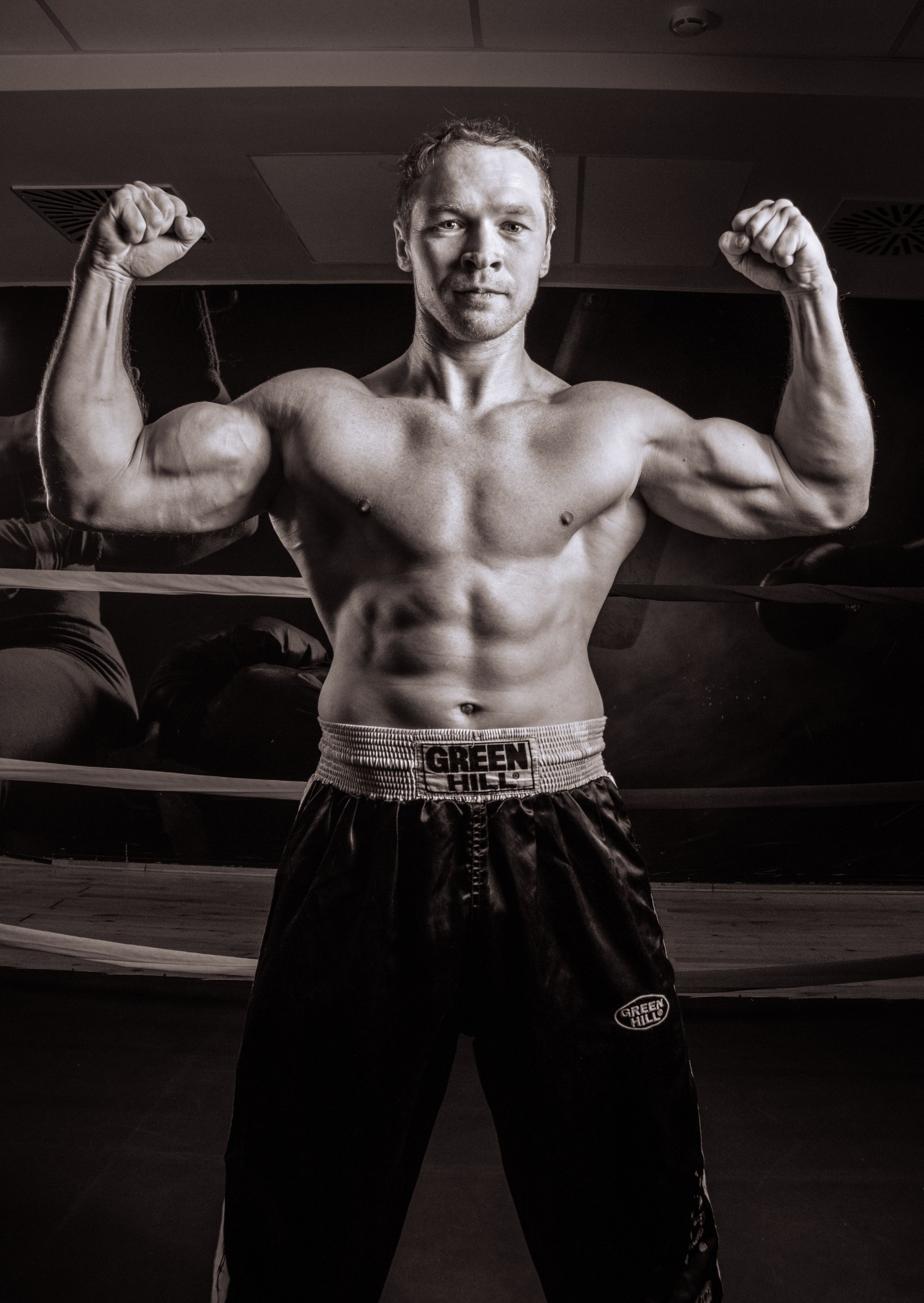 A Shirtless Man Flexing His Muscles · Free Stock Photo