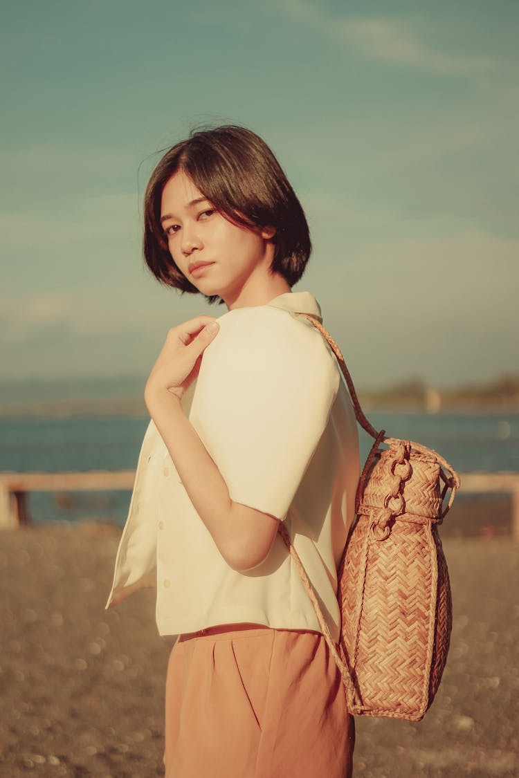 A Woman Carrying A Rattan Bag On Her Back