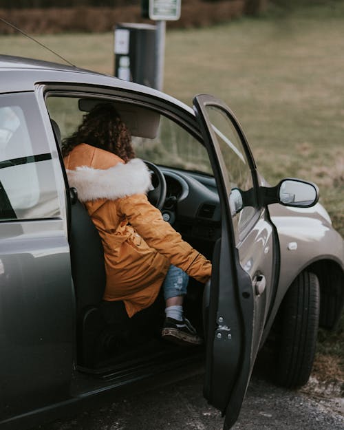 Free Woman Sitting Inside A Car Stock Photo