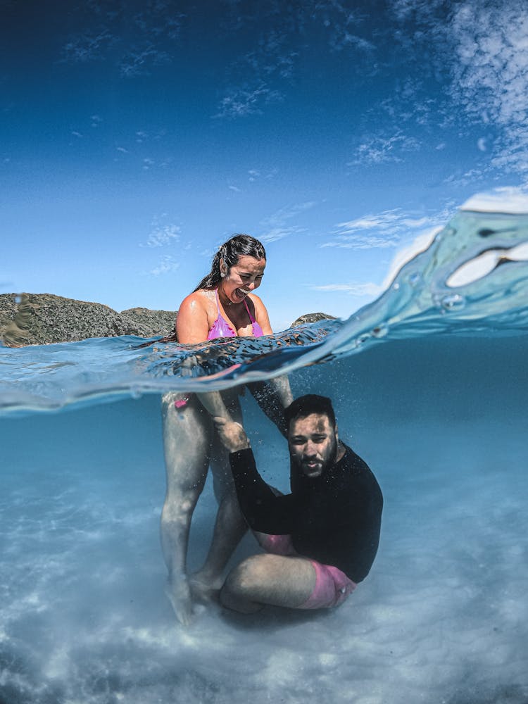 A Couple Swimming In The Sea