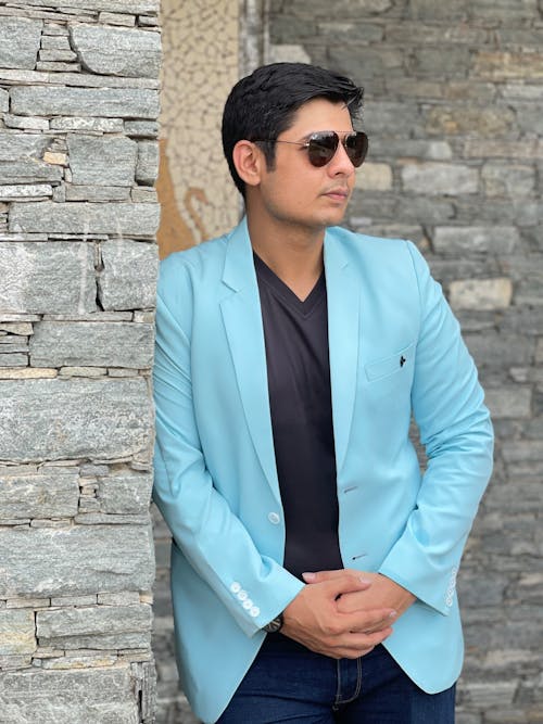 A Man in Blue Suit while Wearing Sunglasses