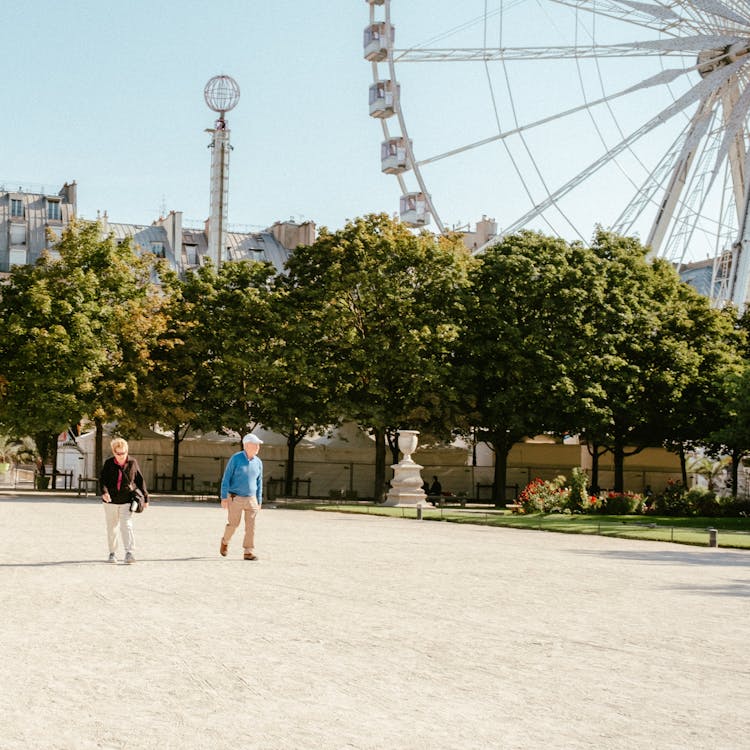 An Elderly People Walking On The Park