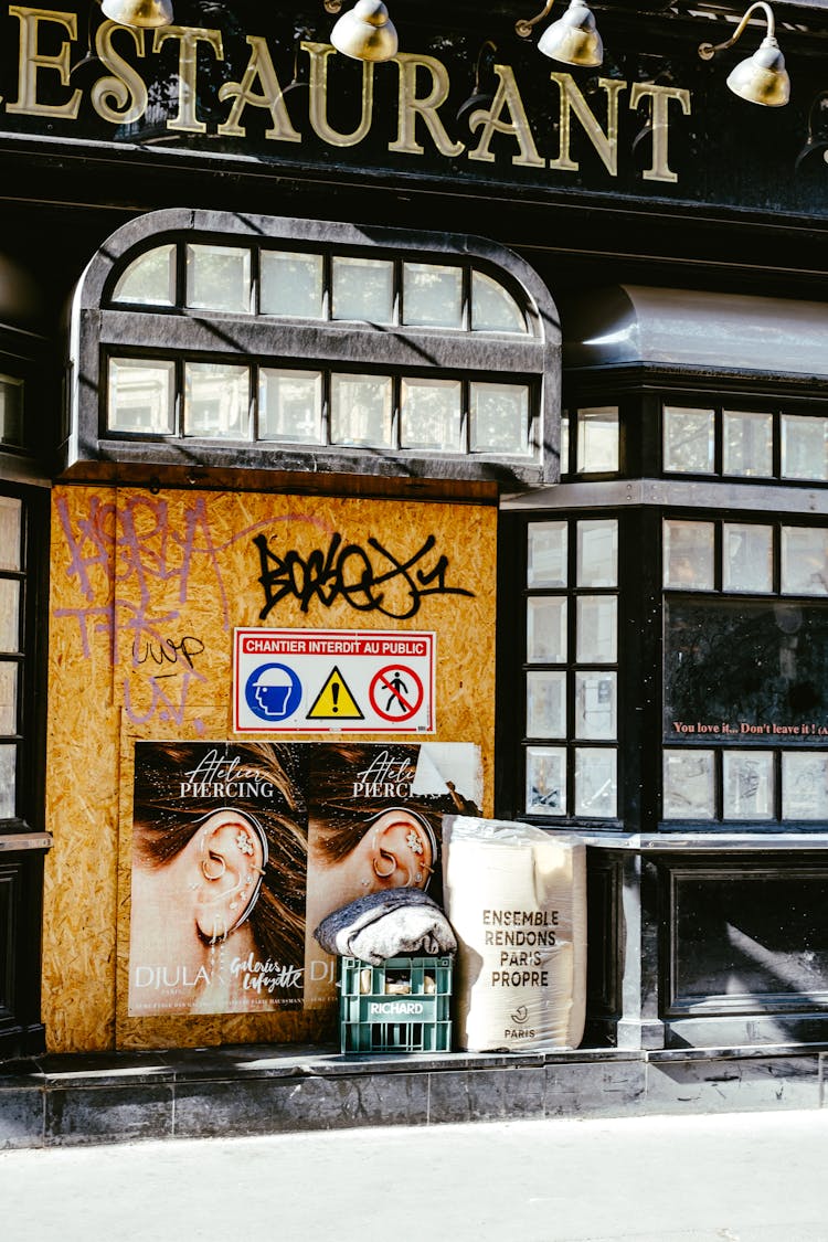 Black Facade Of A Closed Restaurant And Posters