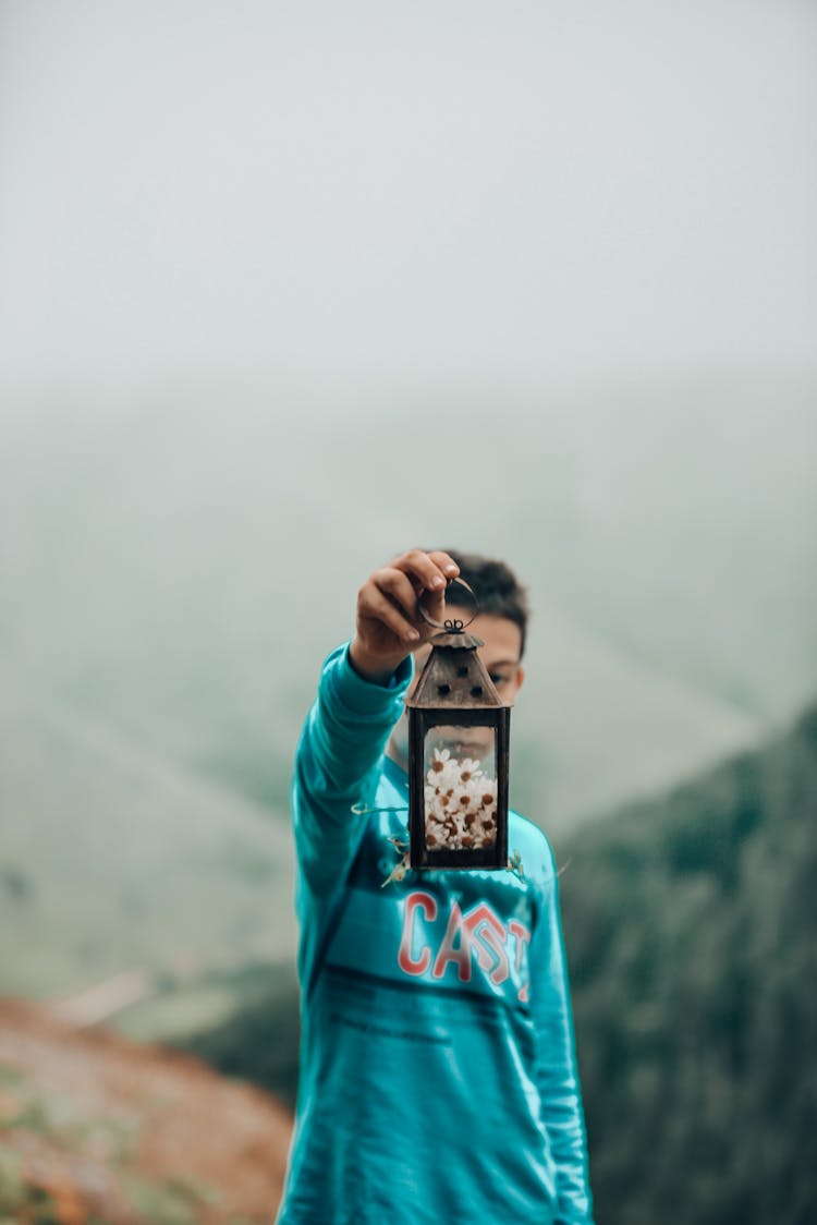 Boy Holding Lantern With Flowers