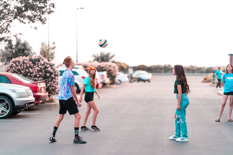 Photo Of A Group Of Friends Playing Volleyball