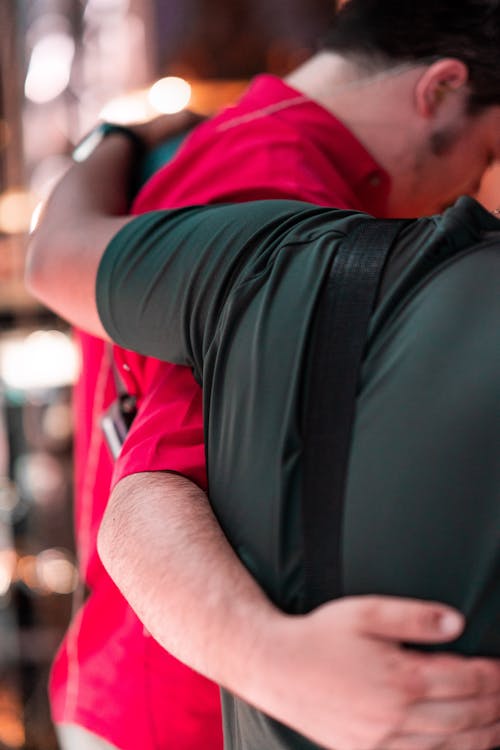 Free Man in Red Shirt and Black Backpack Stock Photo