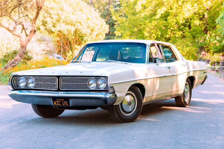 A White Ford Galaxie On Road