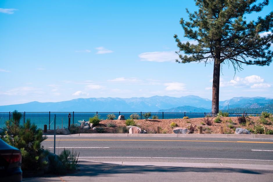 A picturesque view of Lake Tahoe with mountains and clear skies from Tahoe City, California.