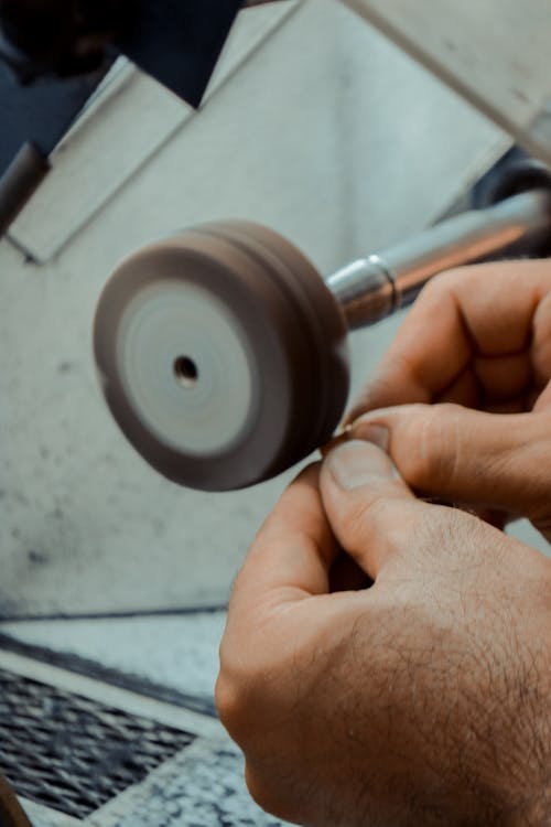 Man Polishing at Grinder