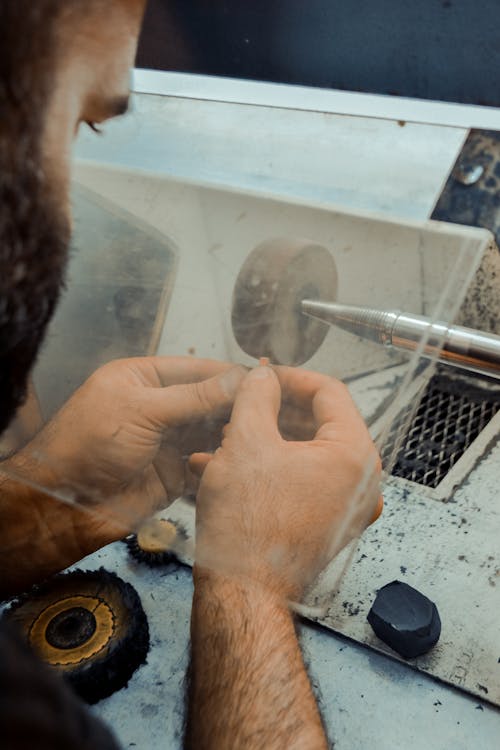 Man Working at Grinder