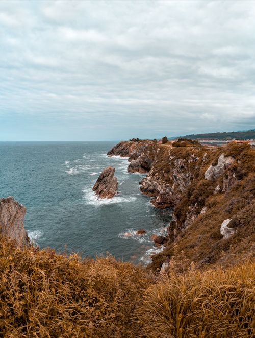 Free Explore the rugged beauty of ocean cliffs with dramatic waves crashing along a scenic coastline. Stock Photo