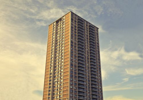 Free A towering modern skyscraper reaching into the sky in downtown New York City, epitomizing urban architecture. Stock Photo