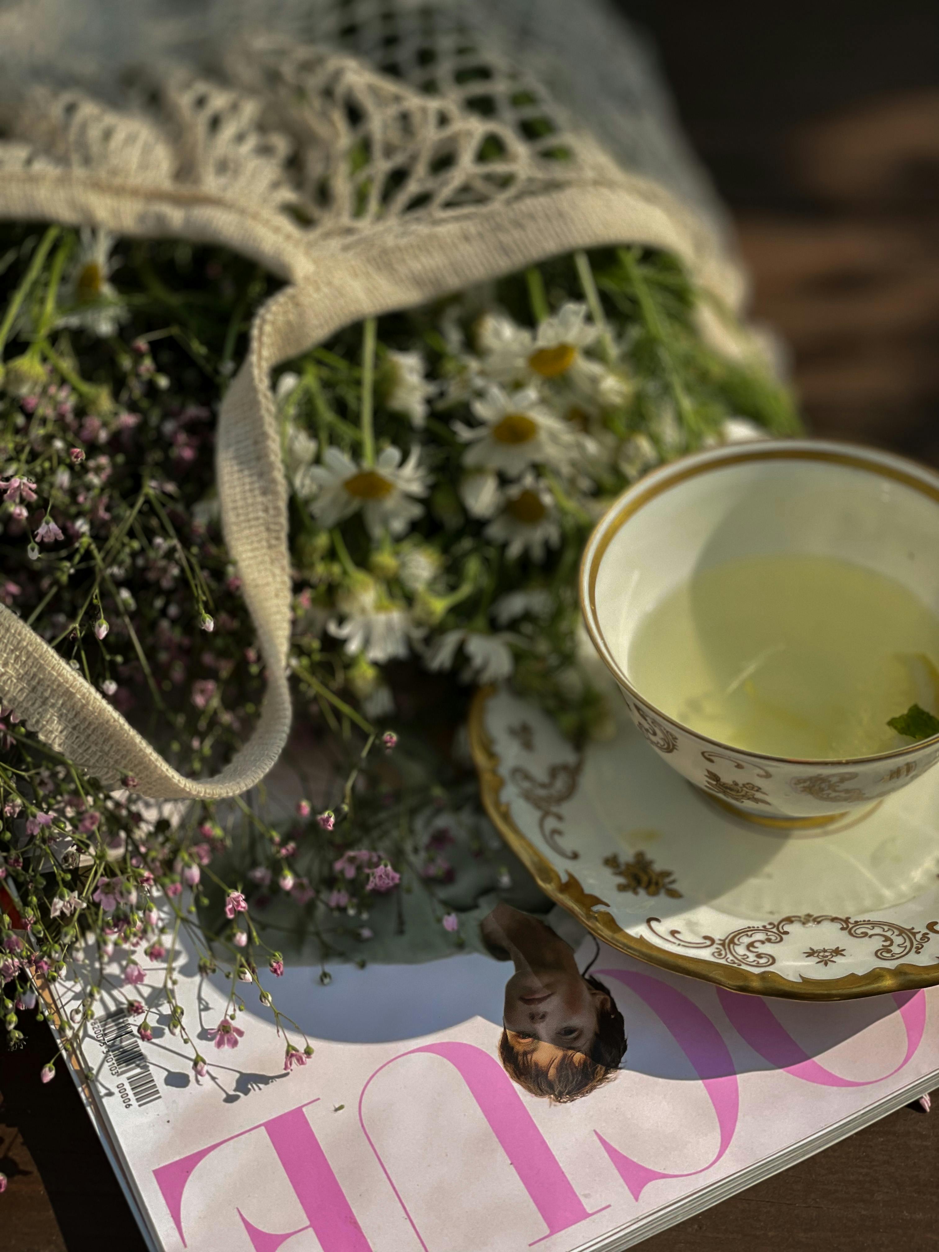 A Cup of Tea Near Wildflowers · Free Stock Photo