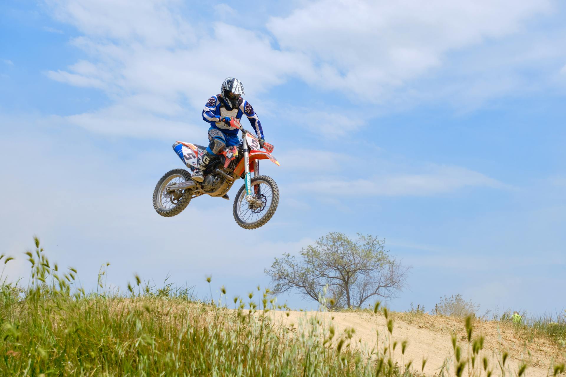 A Man Riding Motocross Dirt Bike on Off-Road