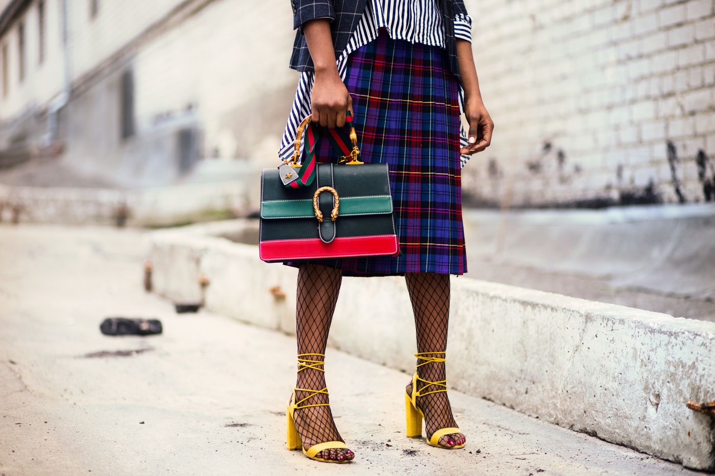 Woman holding a luxury leather handbag