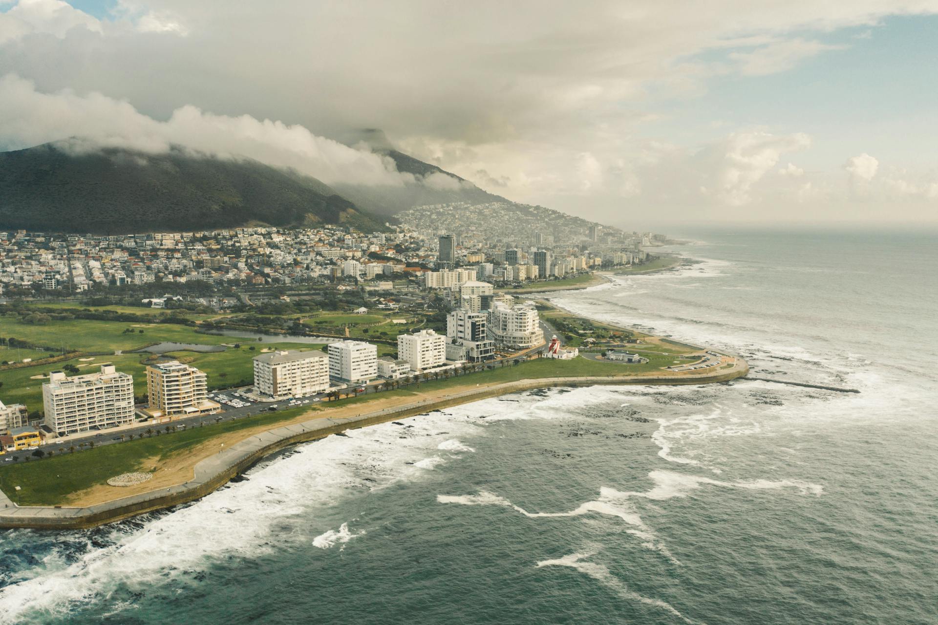 Stunning aerial view of Cape Town showcasing oceanfront and urban landscape.