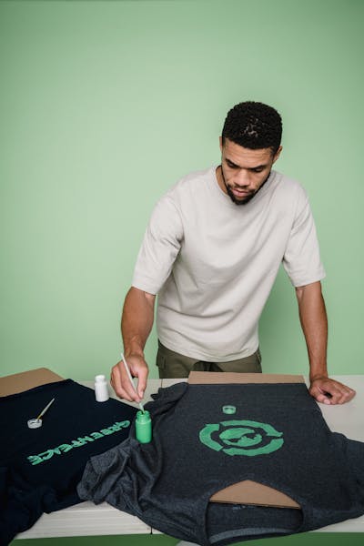 Close-up of an artist sketching a T-shirt design with vibrant colors