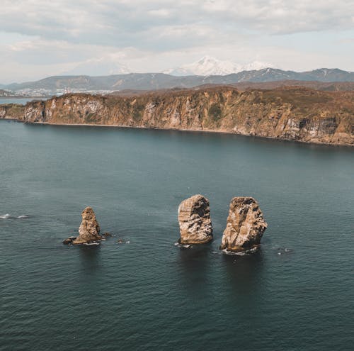 Brown Rock Formations on the Ocean