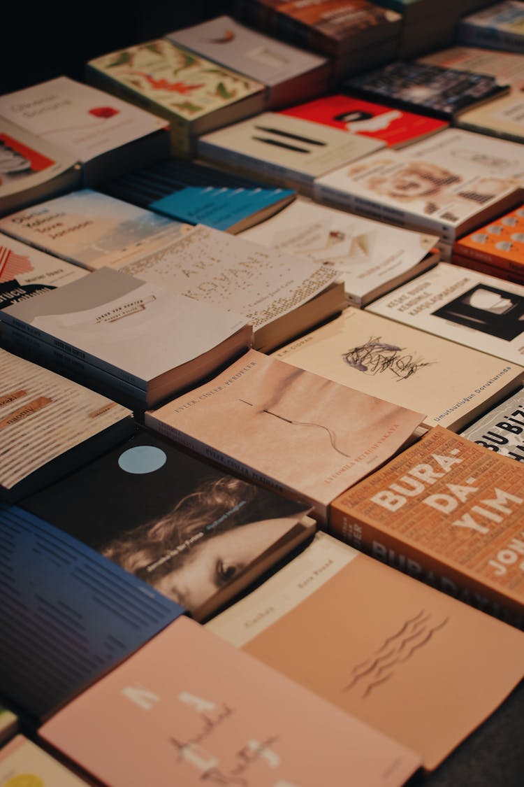 Piles Of Books On Table In Bookstore