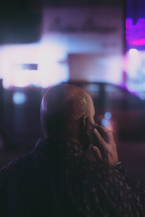 Free Back View Shot of a Man Having a Phone Call Stock Photo