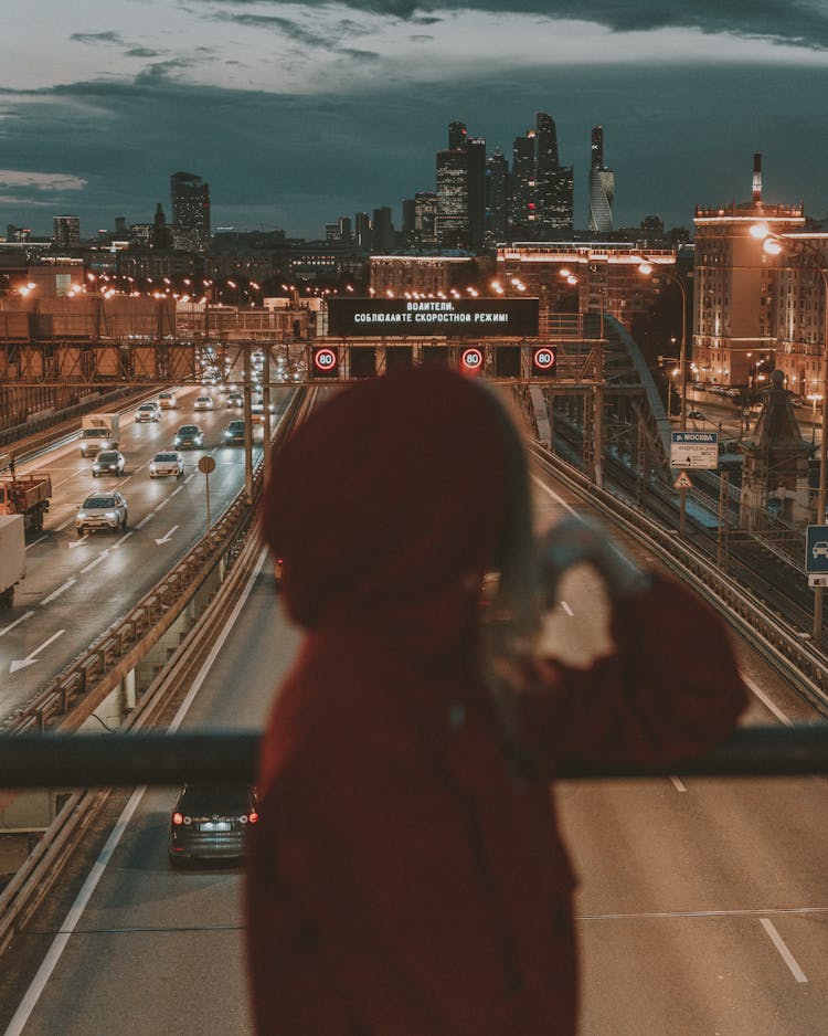 Woman In Traditional Clothes On Bridge At Night City