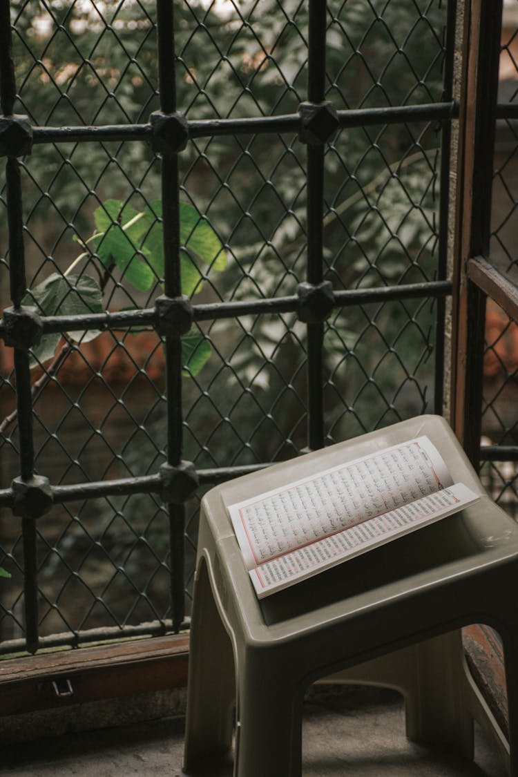 Open Book On Stool On Balcony