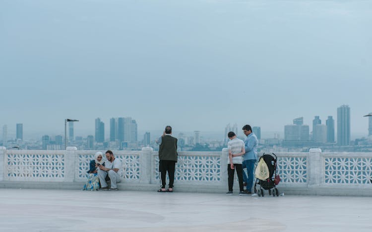 People On Observation Deck, Looking At City