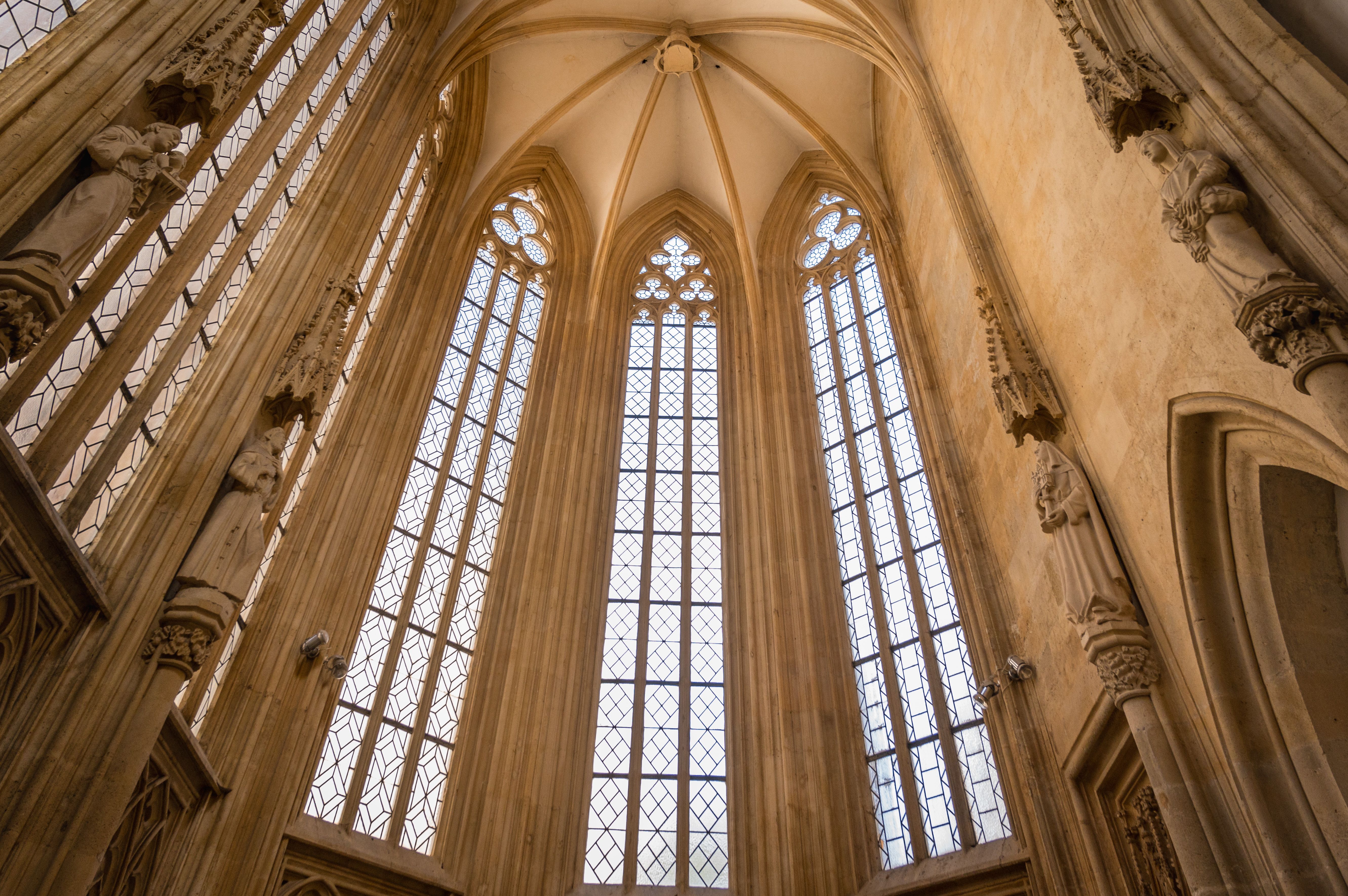 cathedral architecture with light streaming through stained glass windows