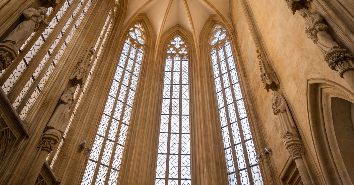 cathedral architecture with light streaming through stained glass windows