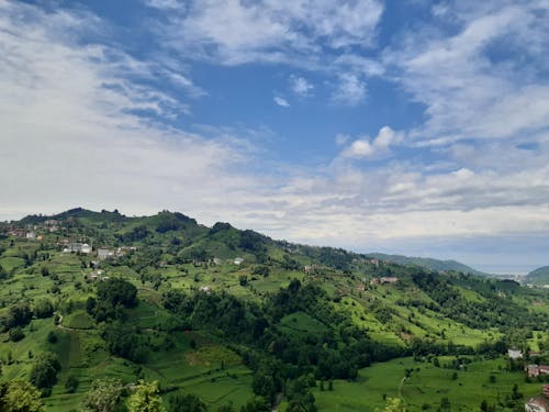 A Green Mountain Under Blue Sky