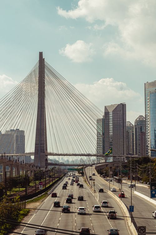 Free Traffic flowing beneath the Octávio Frias de Oliveira Bridge in São Paulo, Brazil. Stock Photo