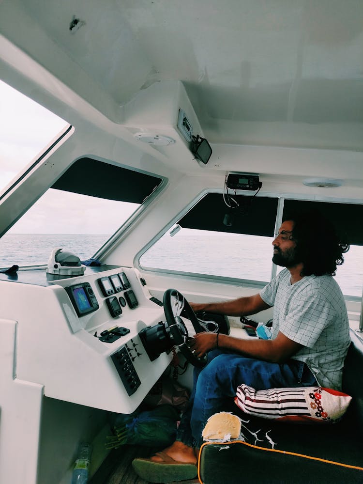 Man Driving A Motorboat 