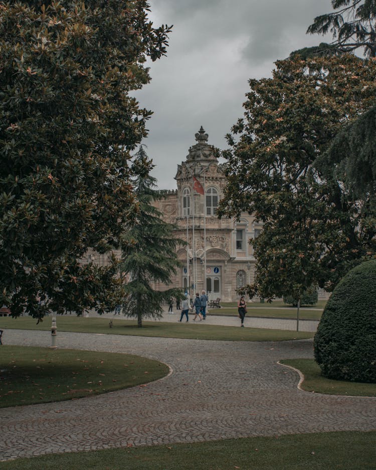 People In Park In Front Of Castle