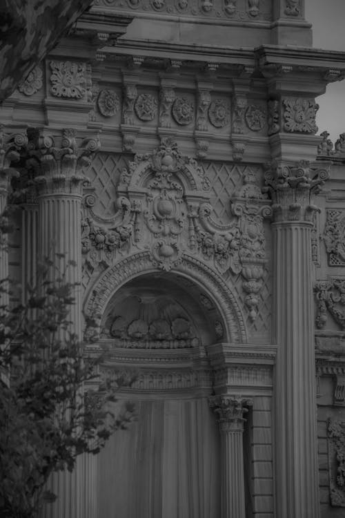 Grayscale Photo of a Concrete Arch