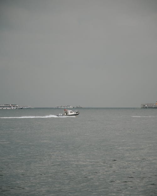 Cruise Ships and Motorboats on the Sea 