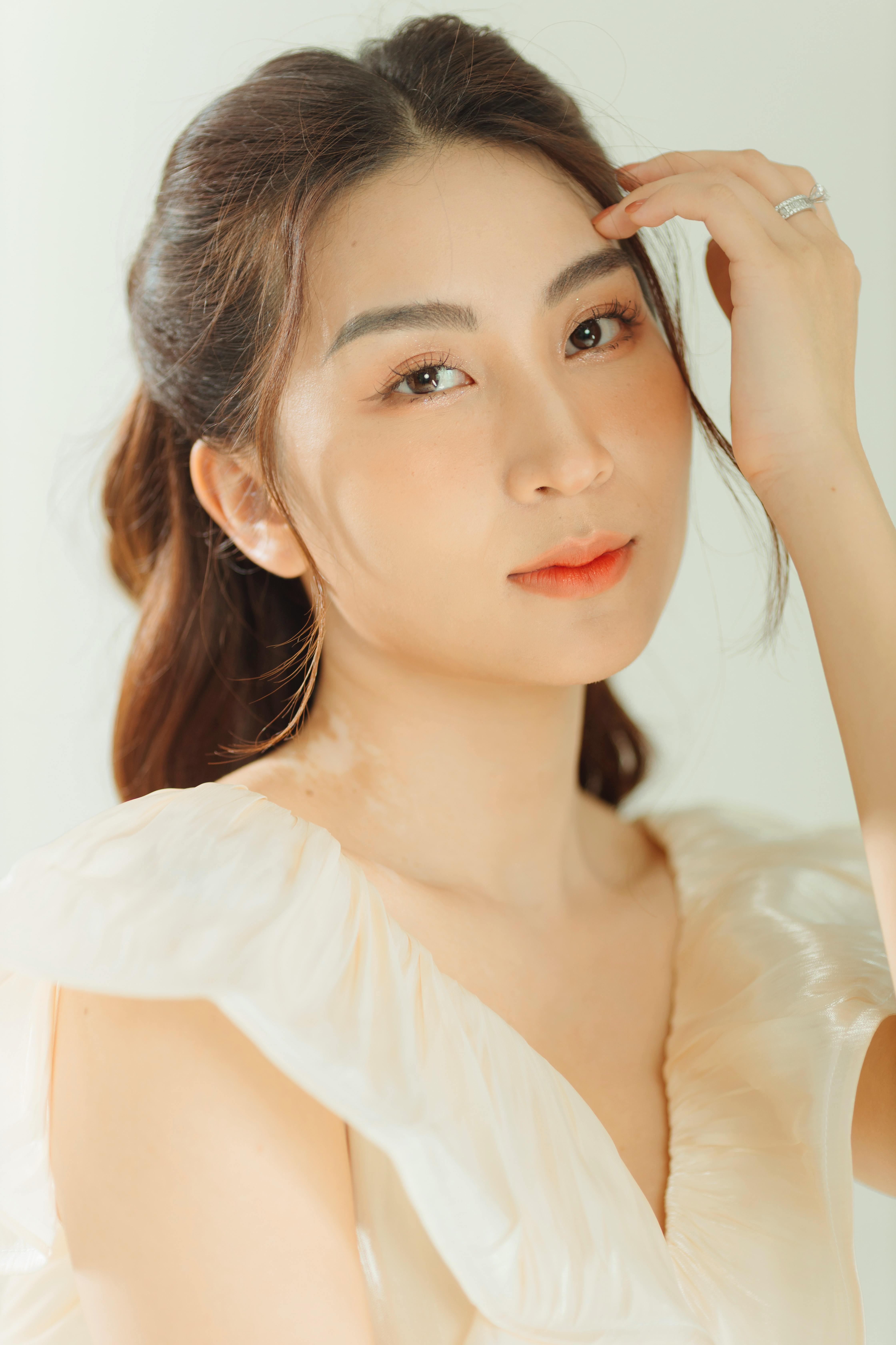 Graceful portrait of a woman with engagement ring in a Quảng Ninh studio setting.
