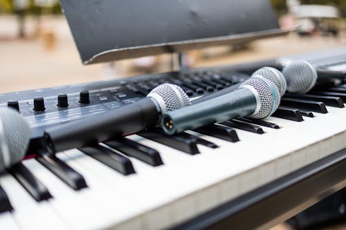 Close-Up Photo of Microphones on an Electronic Keyboard