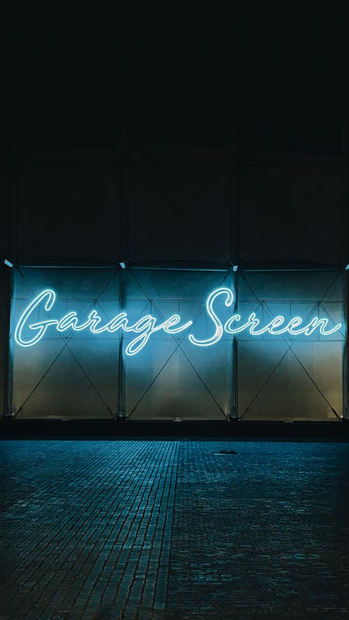 A Neon Signage Lights Up the Darkness of the Night