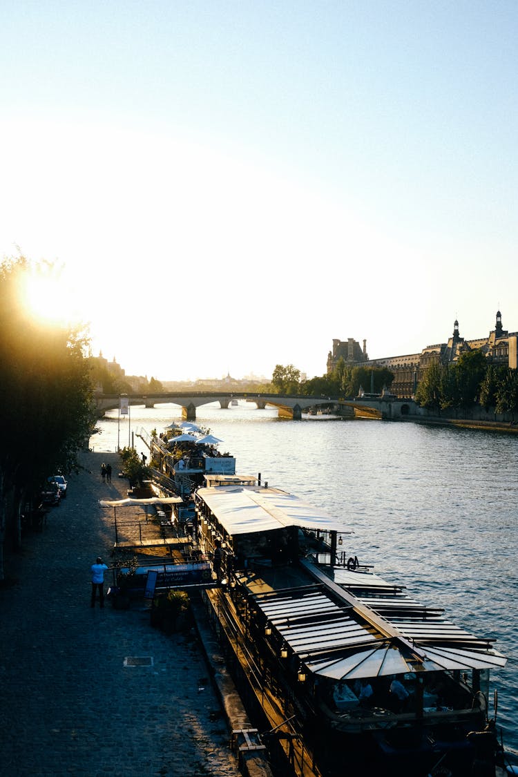 Barges Moored In A River 