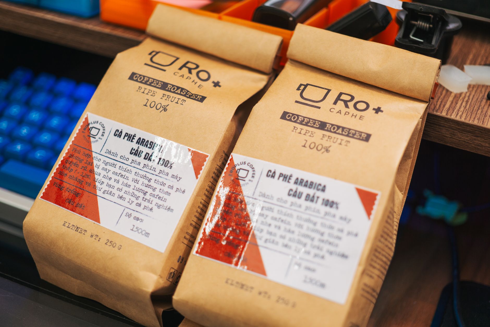 Close-up of premium coffee packaging highlighting Arabica beans with detailed labels in a vibrant setting.