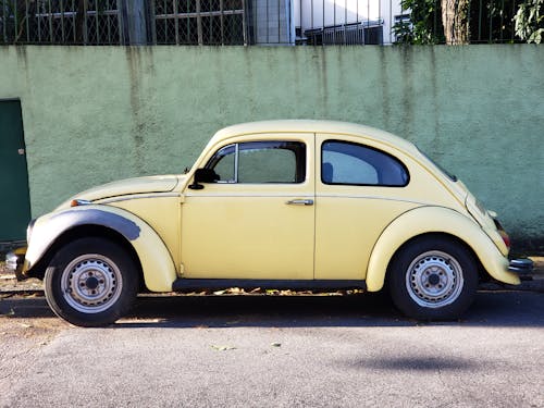 Yellow Volkswagen Beetle Parked on Roadside