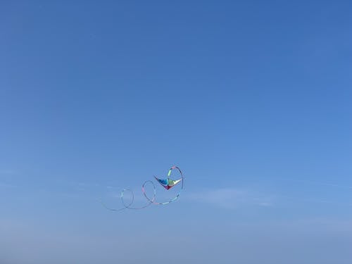 Colorful Kite Flying on Blue Sky
