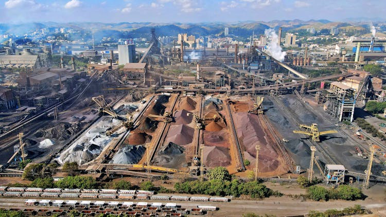 High Angle View Of An Industrial Landscape With Slag Heaps And Cranes