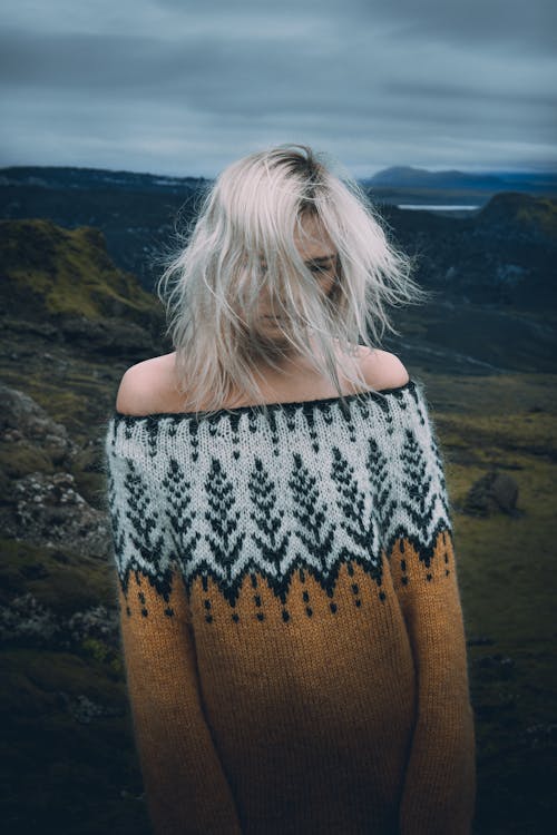 Woman with Gray Hair Wearing an Off Shoulder Knitted Sweater