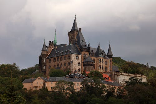 Brown Concrete Castle Under Cloudy Sky