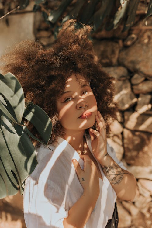 Woman in White and Green Shirt